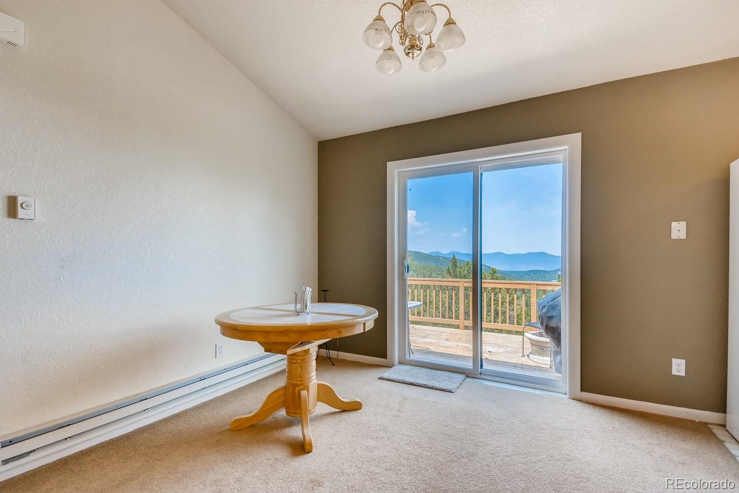 541 Paiute Road Evergreen, CO 80439 - Photo 6 of 22 a view of a room with gym equipment