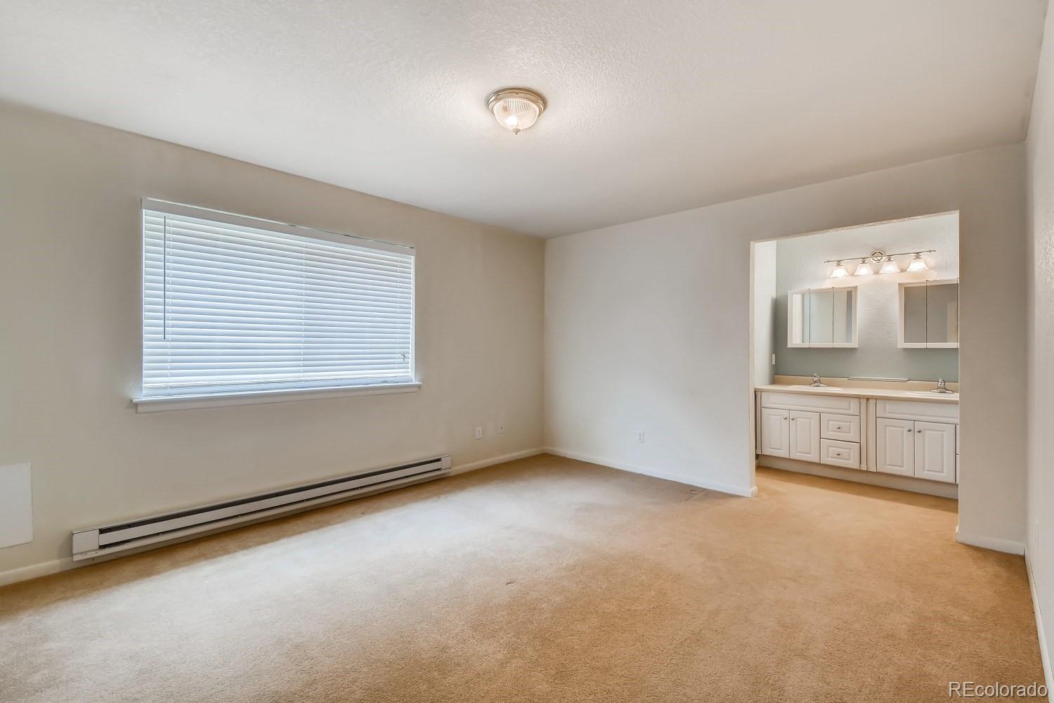 541 Paiute Road Evergreen, CO 80439 - Photo 10 of 22 wooden floor in an empty room with a window