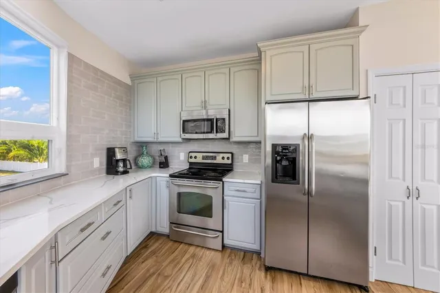 a bathroom with a double vanity sink mirror and toilet