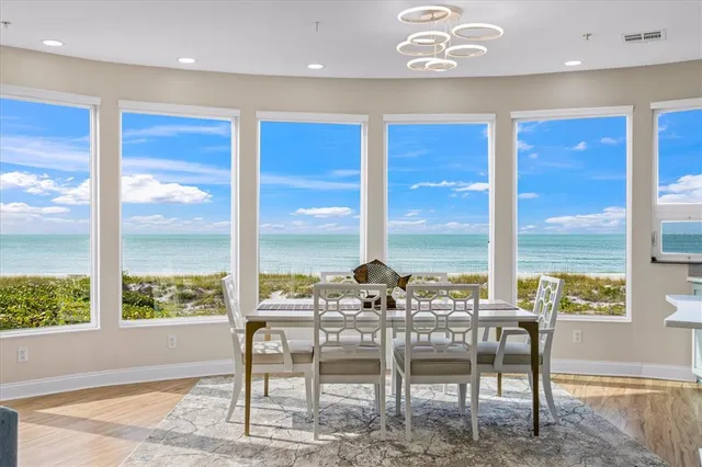 a kitchen with stainless steel appliances granite countertop a stove a sink dishwasher and wooden cabinets
