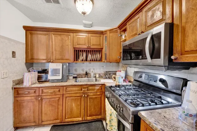 a view of walk in closet with furniture and a window