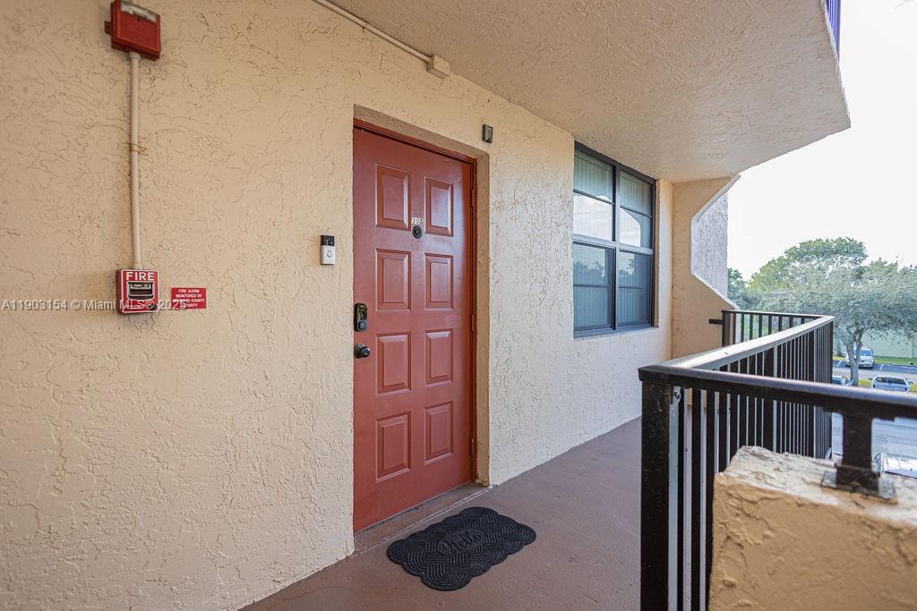 3450 Blue Lake Drive, Unit 305 Pompano Beach, FL 33064 - Photo 16 of 66 a view of a hallway with workspace