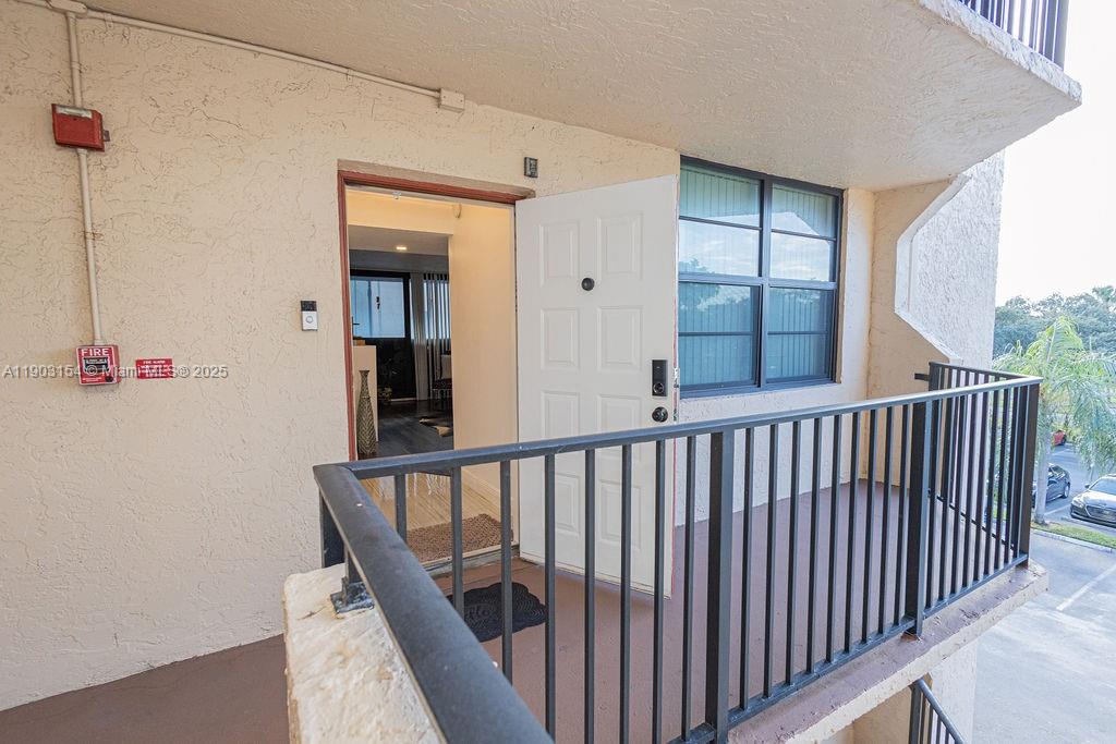 3450 Blue Lake Drive, Unit 305 Pompano Beach, FL 33064 - Photo 21 of 66 a view of a balcony