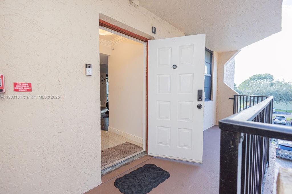 3450 Blue Lake Drive, Unit 305 Pompano Beach, FL 33064 - Photo 22 of 66 a view of elevator with hallway