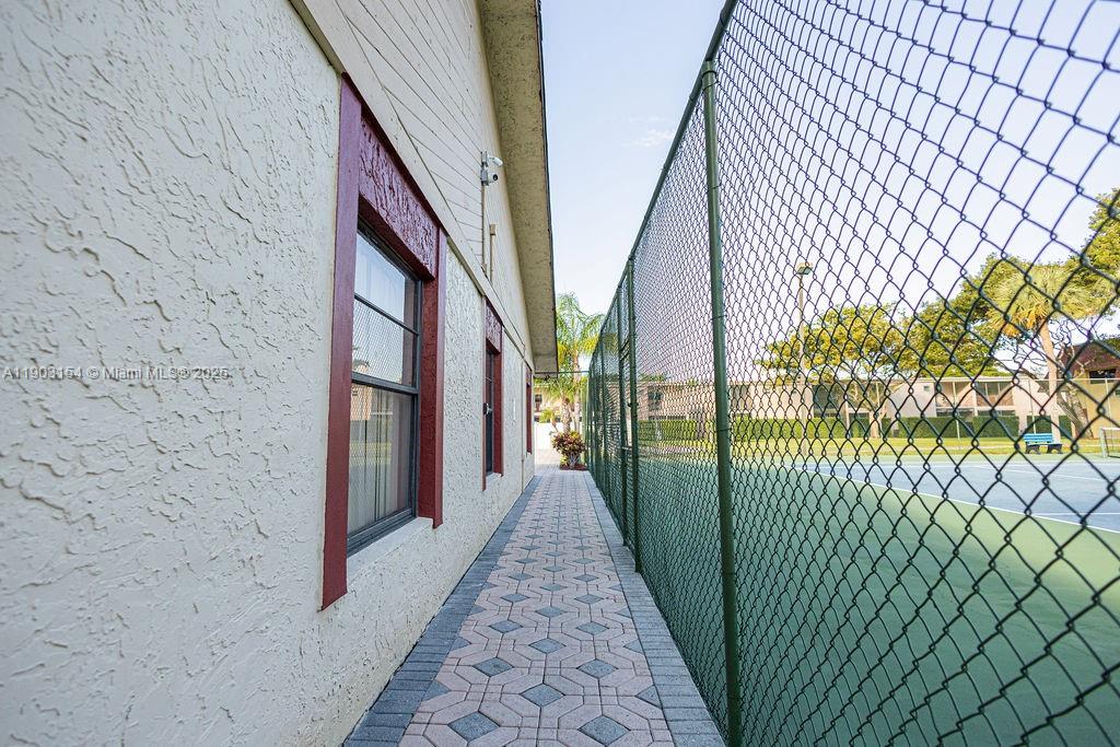 3450 Blue Lake Drive, Unit 305 Pompano Beach, FL 33064 - Photo 23 of 66 a view of a pathway of a building