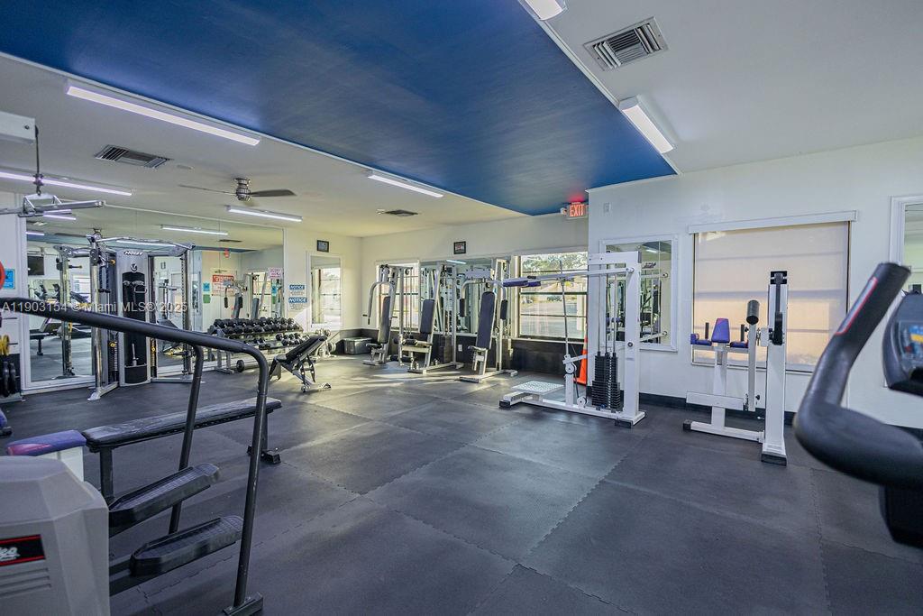 3450 Blue Lake Drive, Unit 305 Pompano Beach, FL 33064 - Photo 31 of 66 a living room with lots of furniture and lots of furniture