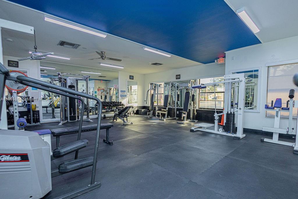 3450 Blue Lake Drive, Unit 305 Pompano Beach, FL 33064 - Photo 32 of 66 a view of a room with lots of wooden furniture