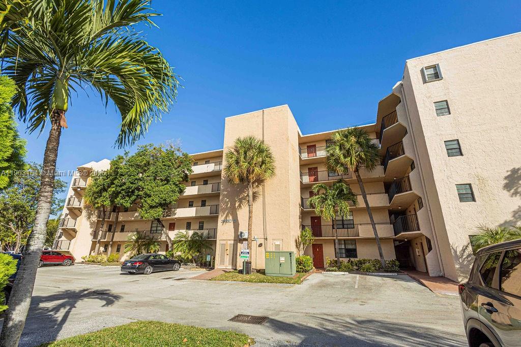 3450 Blue Lake Drive, Unit 305 Pompano Beach, FL 33064 - Photo 40 of 66 a view of a building with a street