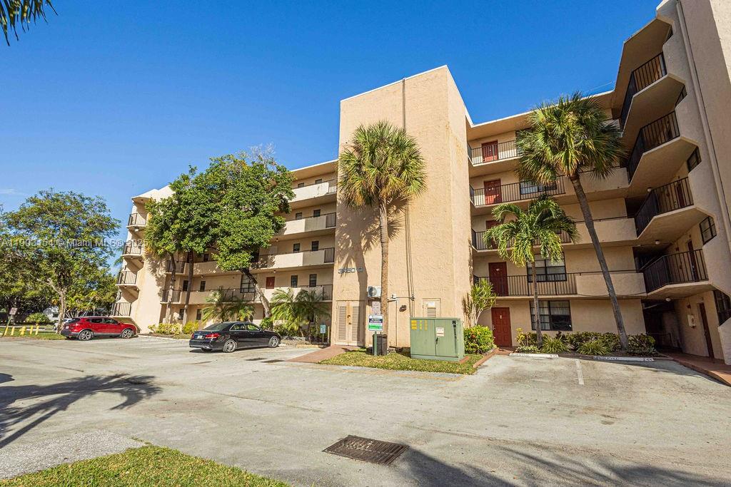 3450 Blue Lake Drive, Unit 305 Pompano Beach, FL 33064 - Photo 41 of 66 a view of a building with a street