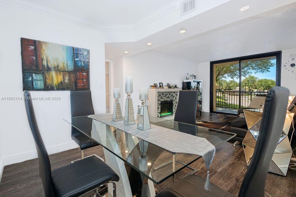 3450 Blue Lake Drive, Unit 305 Pompano Beach, FL 33064 - Photo 43 of 66 a workspace with furniture and a flat screen tv