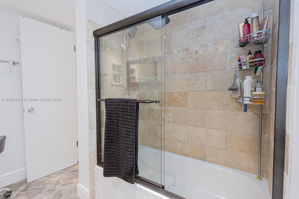 3450 Blue Lake Drive, Unit 305 Pompano Beach, FL 33064 - Photo 58 of 66 a bathroom with a shower