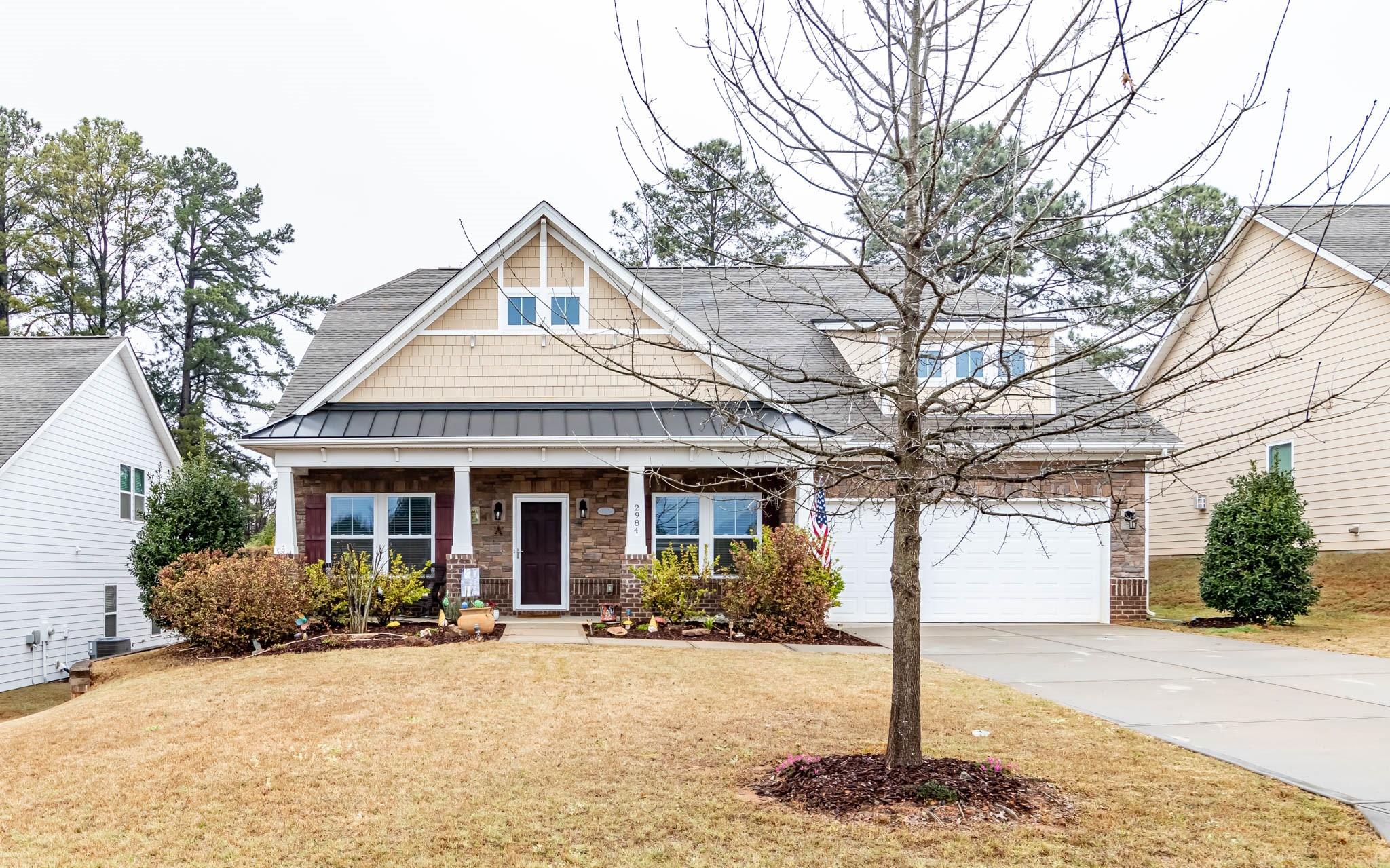 2984 Hiddenbrook Way Indian Land, SC 29707 - Photo 1 of 32 a front view of a house with yard and trees
