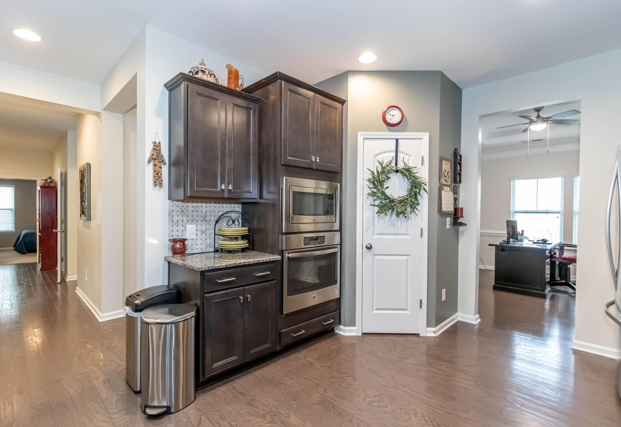 2984 Hiddenbrook Way Indian Land, SC 29707 - Photo 11 of 32 a kitchen with a refrigerator and a stove