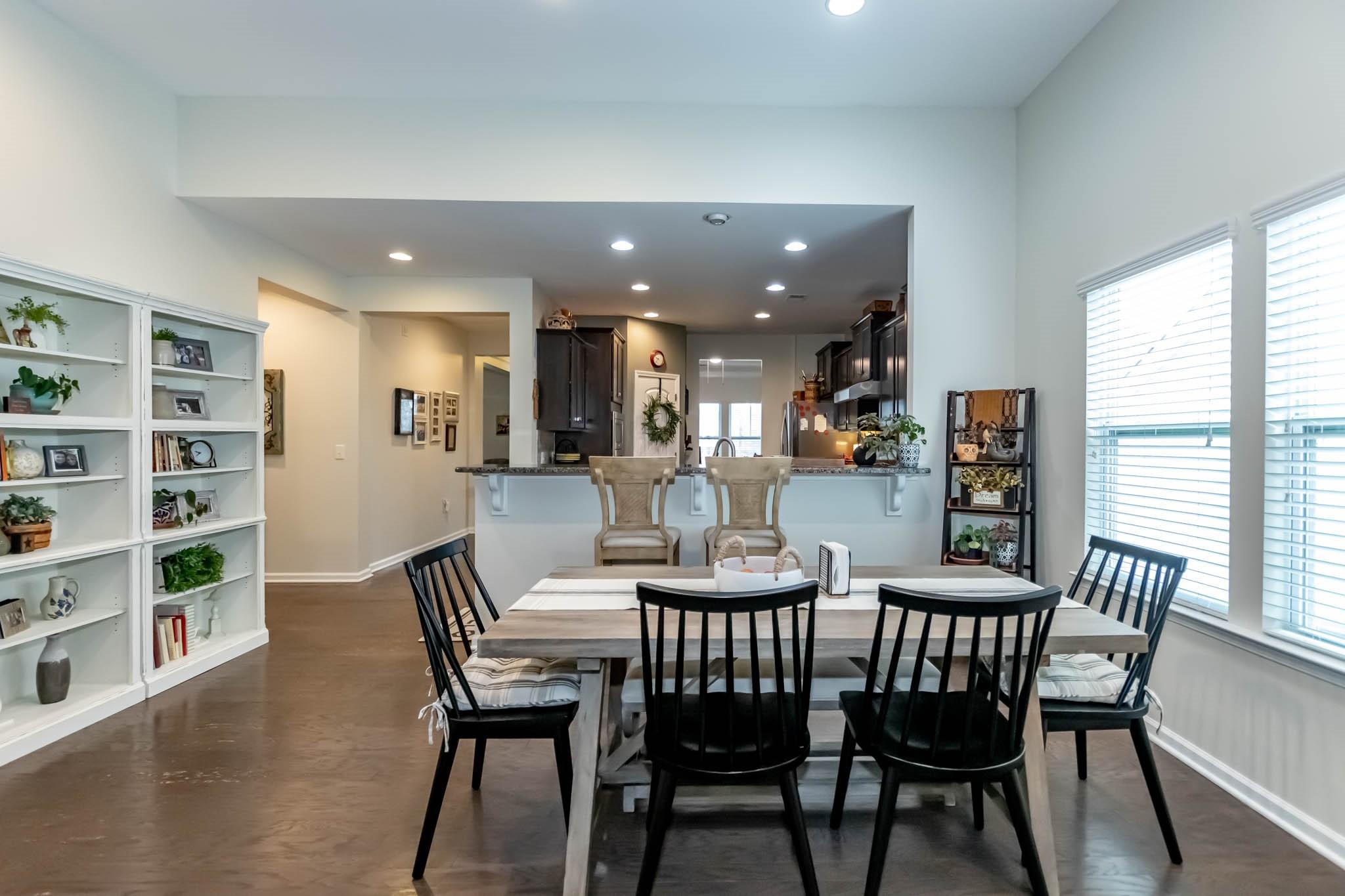 2984 Hiddenbrook Way Indian Land, SC 29707 - Photo 14 of 32 a view of a dining room with furniture and a potted plant
