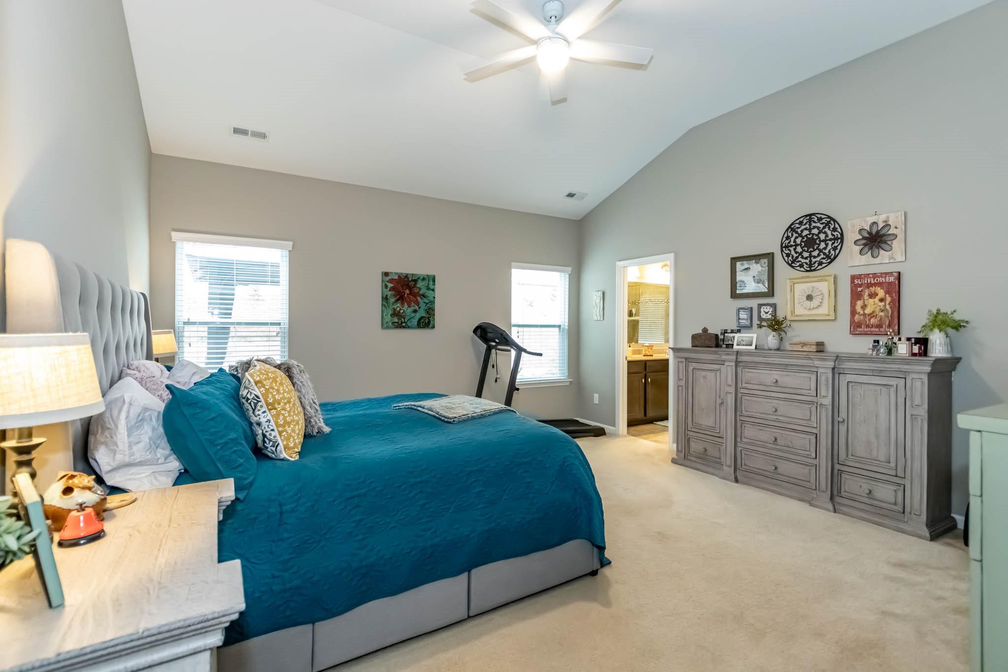 2984 Hiddenbrook Way Indian Land, SC 29707 - Photo 17 of 32 a spacious bedroom with a bed and wooden floor