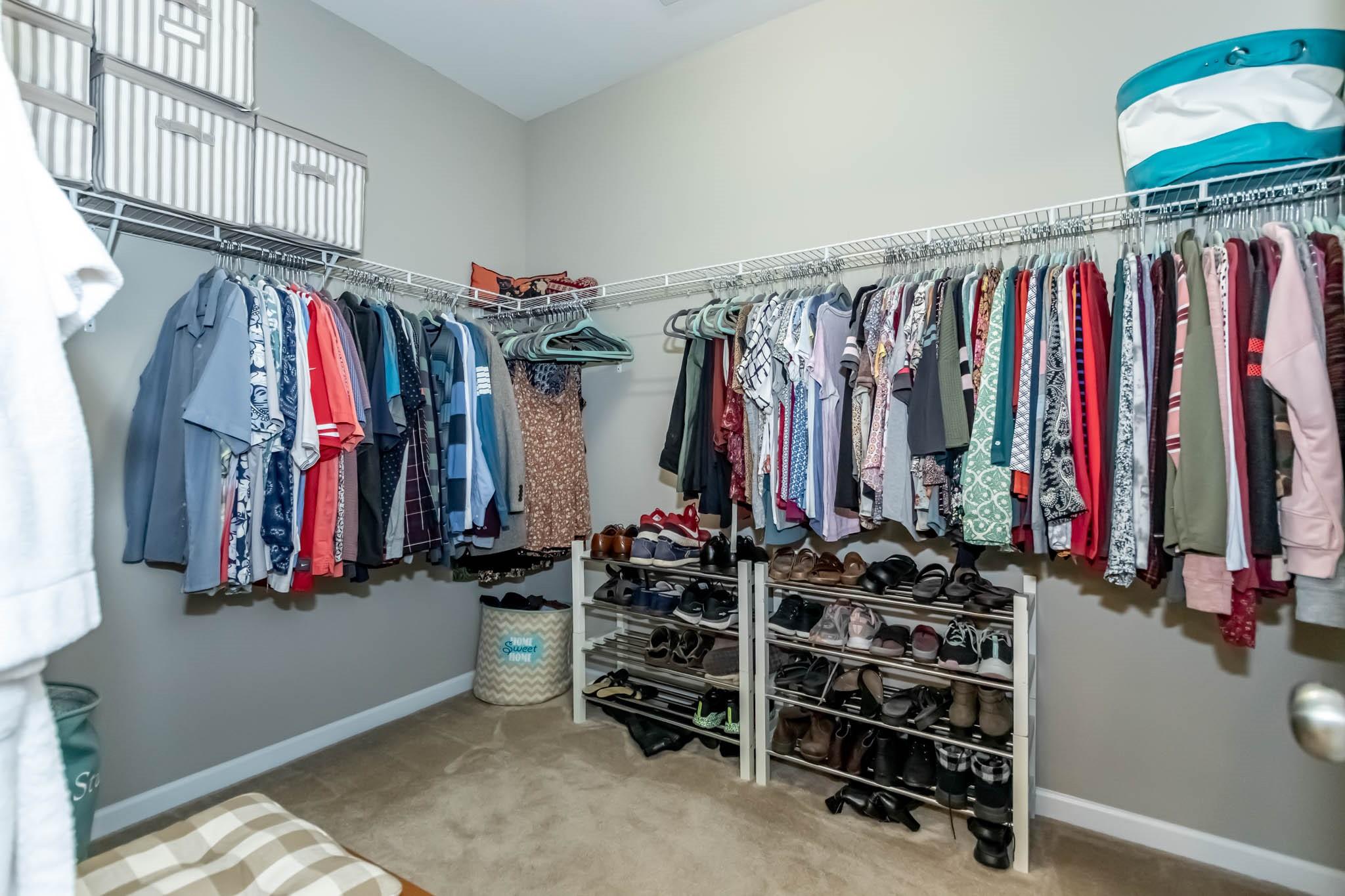 2984 Hiddenbrook Way Indian Land, SC 29707 - Photo 21 of 32 a view of walk in closet with clothes and shoes