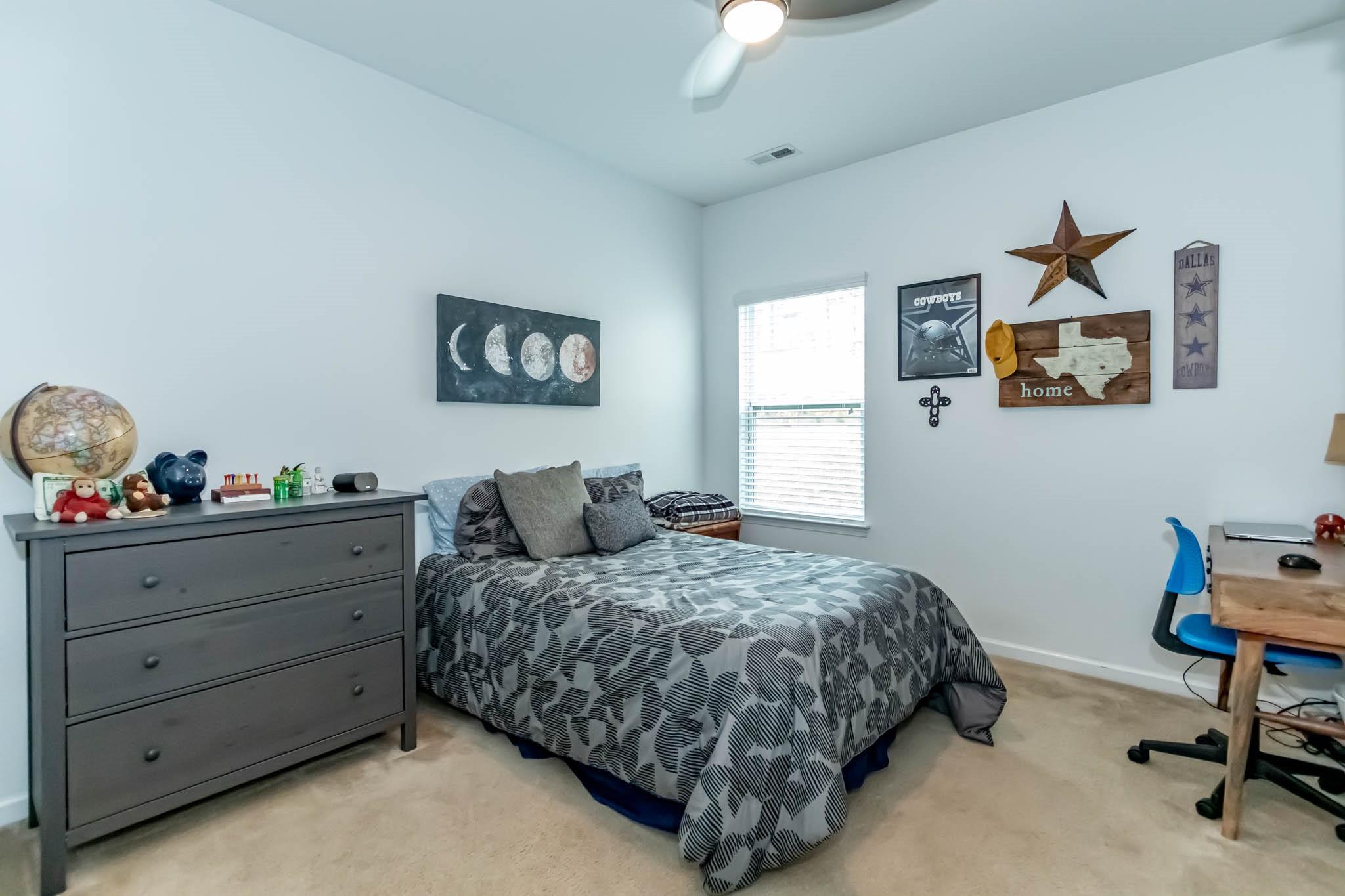 2984 Hiddenbrook Way Indian Land, SC 29707 - Photo 25 of 32 a bedroom with bed and a chandelier