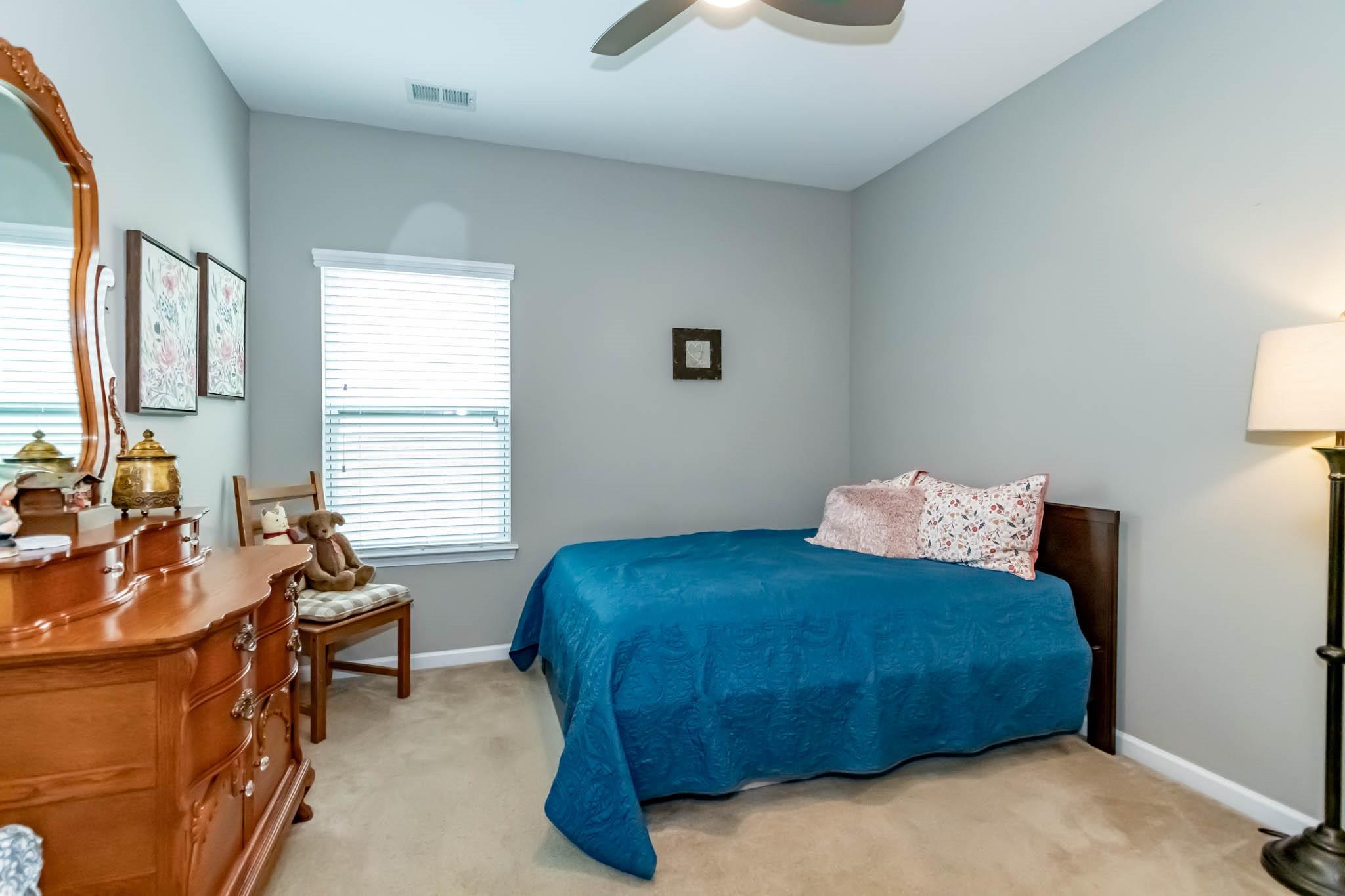 2984 Hiddenbrook Way Indian Land, SC 29707 - Photo 26 of 32 a bedroom with a bed and wooden floor