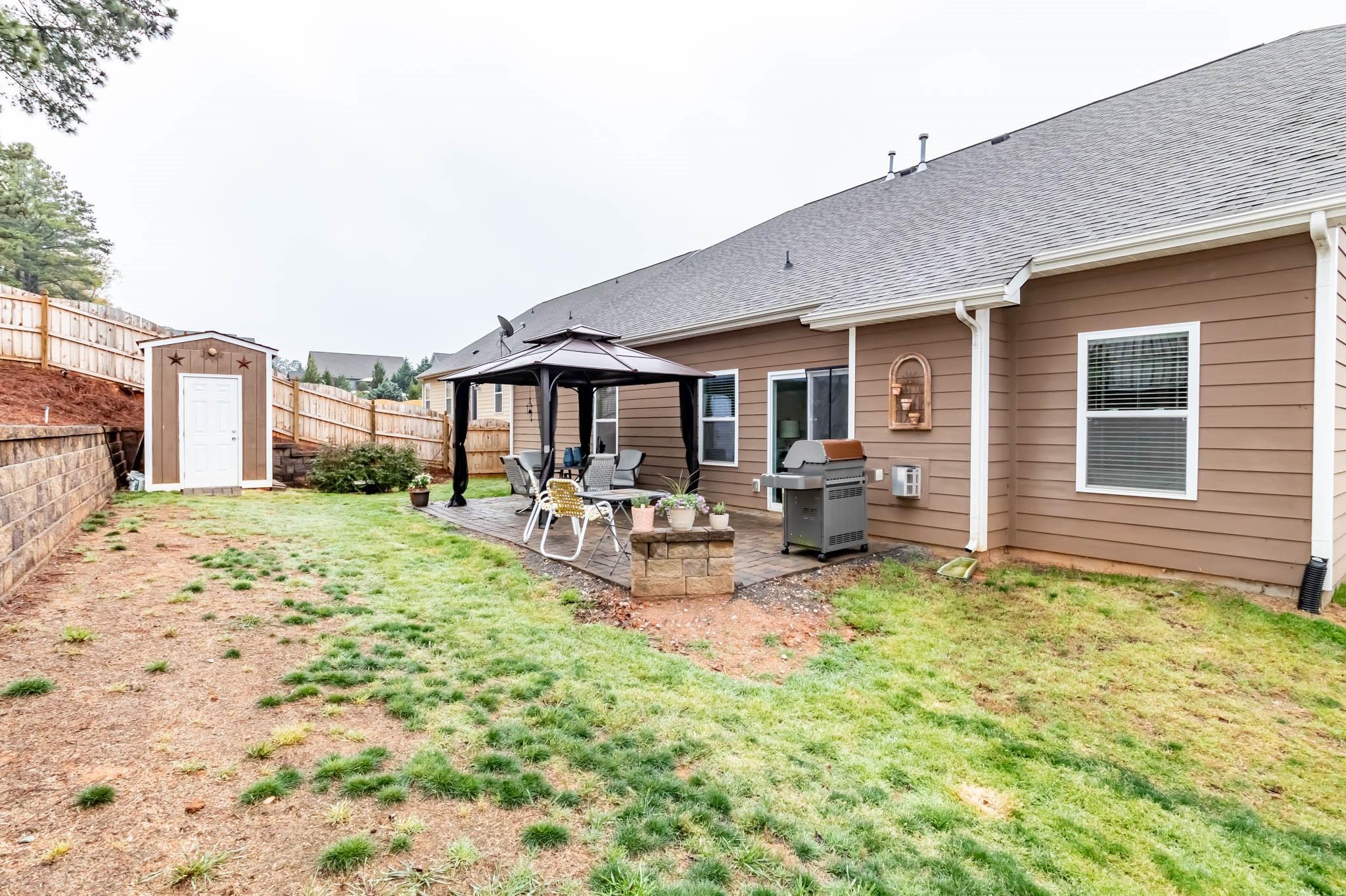 2984 Hiddenbrook Way Indian Land, SC 29707 - Photo 31 of 32 a view of a house with backyard porch and sitting area