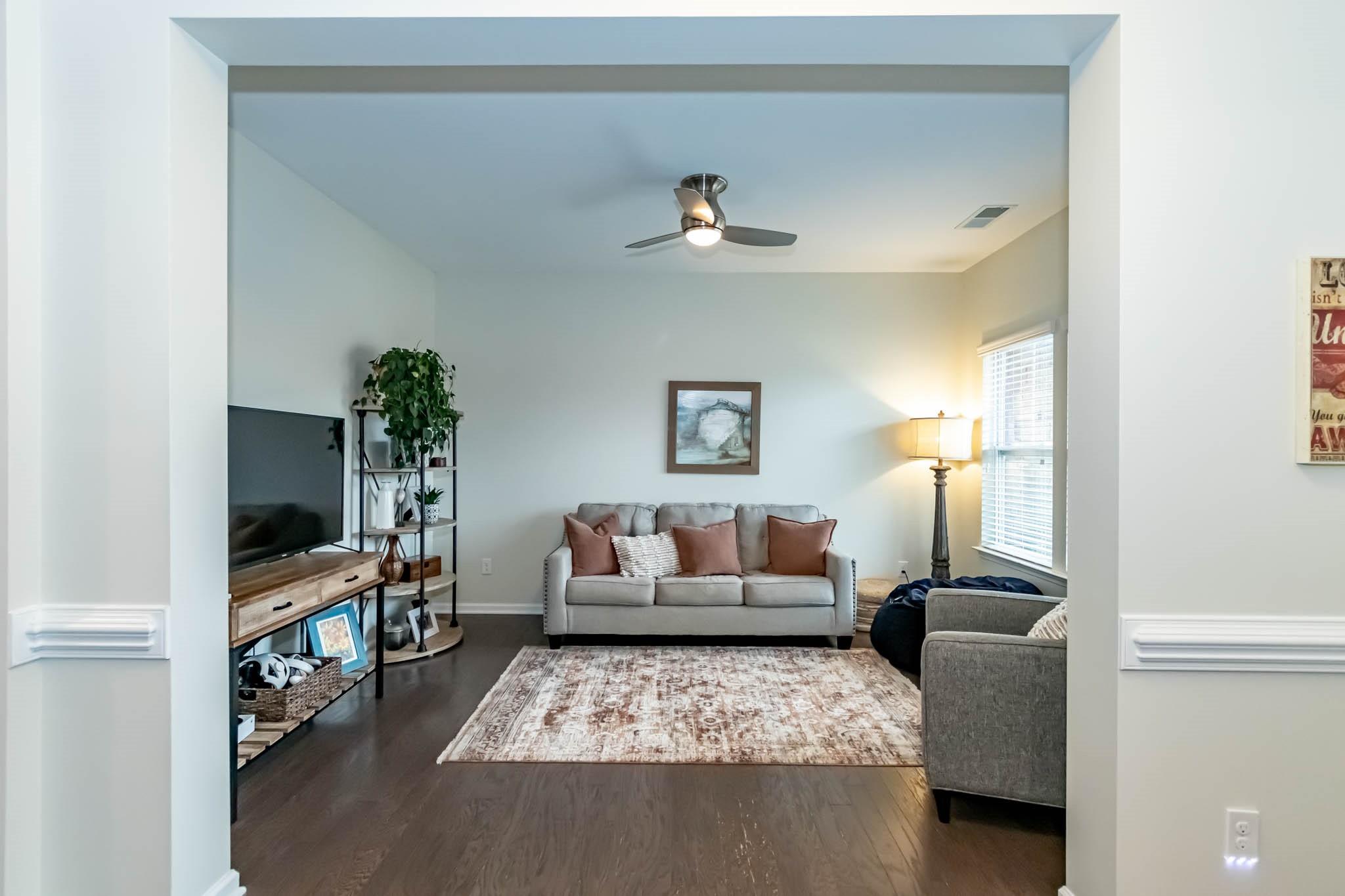 2984 Hiddenbrook Way Indian Land, SC 29707 - Photo 5 of 32 a living room with furniture and a flat screen tv