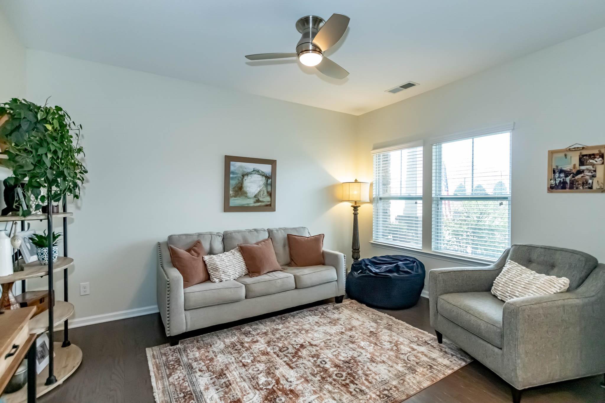 2984 Hiddenbrook Way Indian Land, SC 29707 - Photo 6 of 32 a living room with furniture and a large window