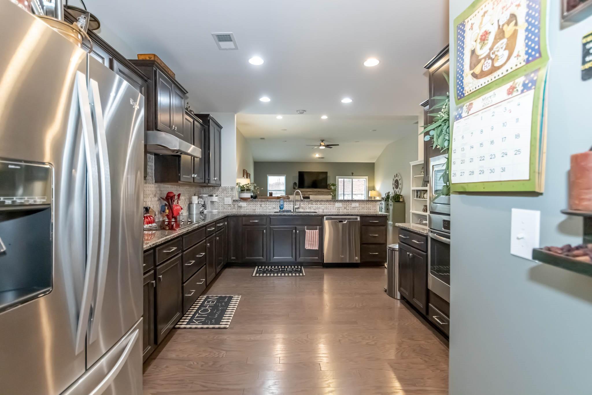 2984 Hiddenbrook Way Indian Land, SC 29707 - Photo 10 of 32 a kitchen with stainless steel appliances a refrigerator sink and microwave