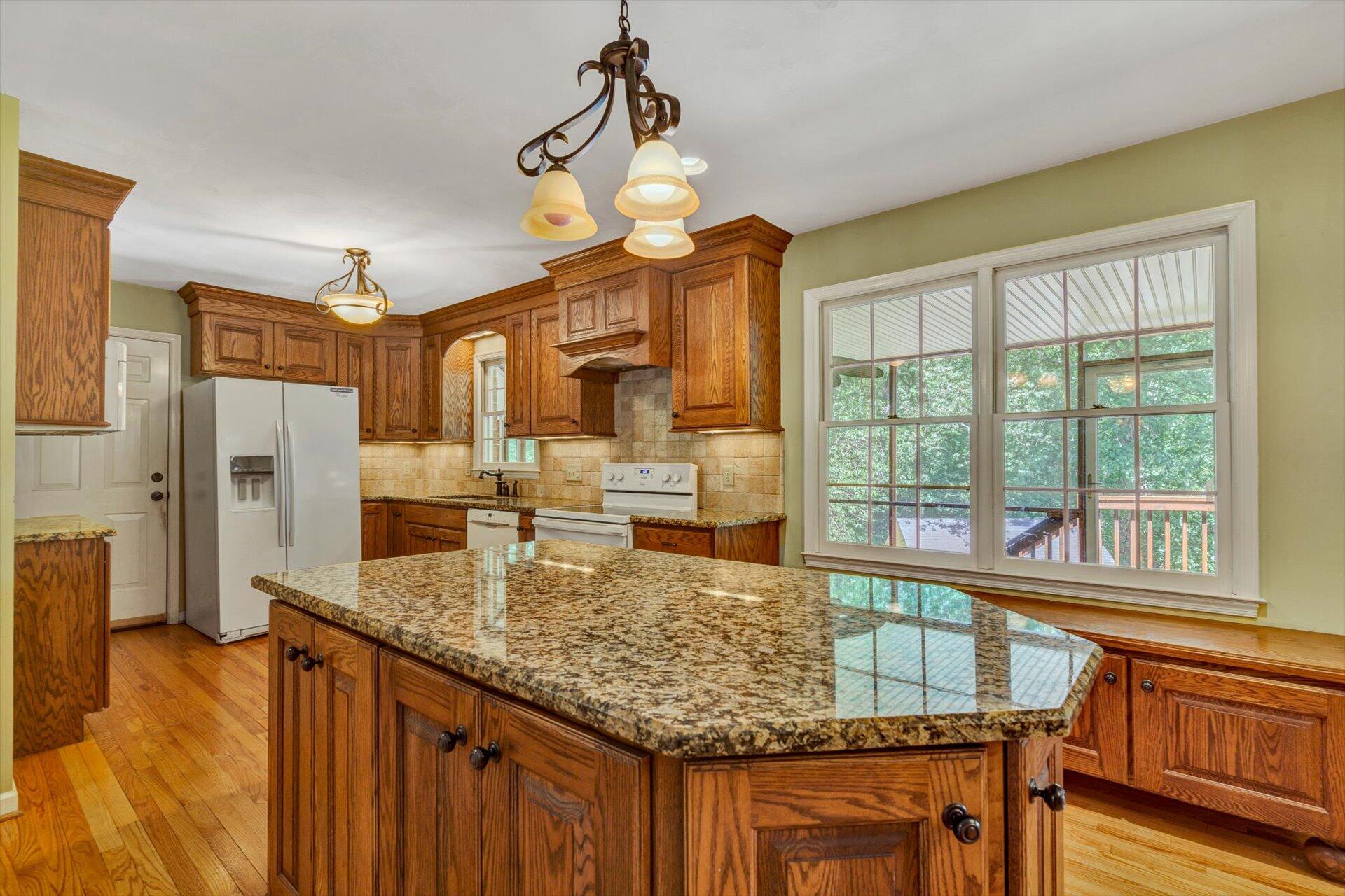 43 Nottingham Lane Blue Ridge, VA 24064 - Photo 14 of 51 a kitchen with kitchen island granite countertop a stove and a sink