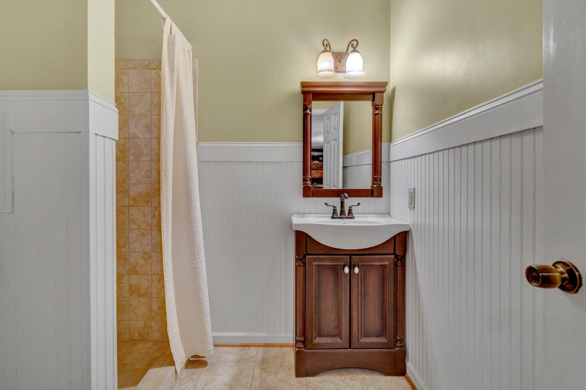 43 Nottingham Lane Blue Ridge, VA 24064 - Photo 25 of 51 a bathroom with a sink and a mirror