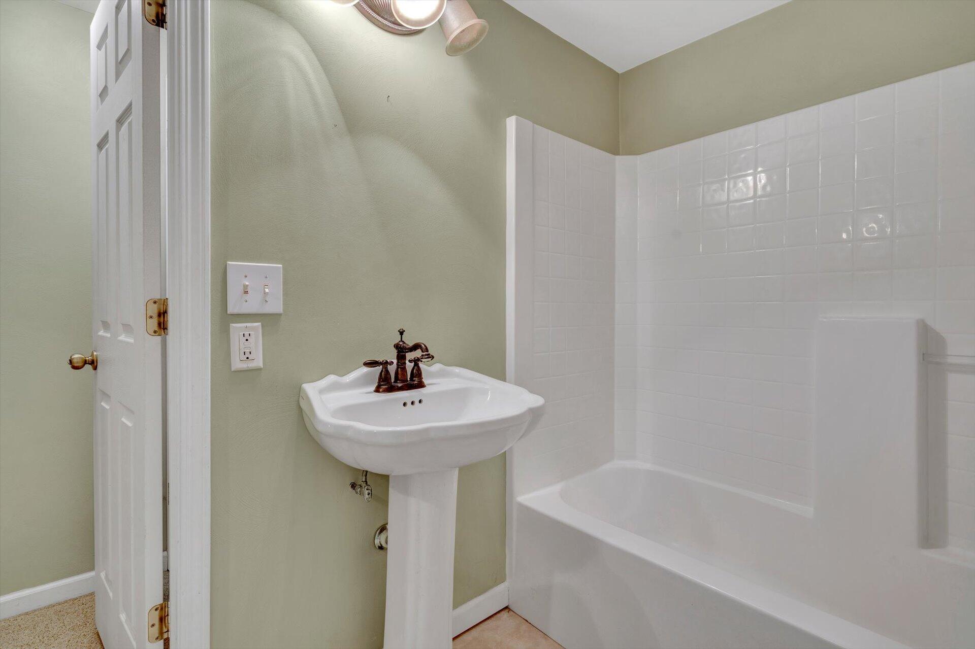 43 Nottingham Lane Blue Ridge, VA 24064 - Photo 30 of 51 a bathroom with a sink a mirror and a bathtub