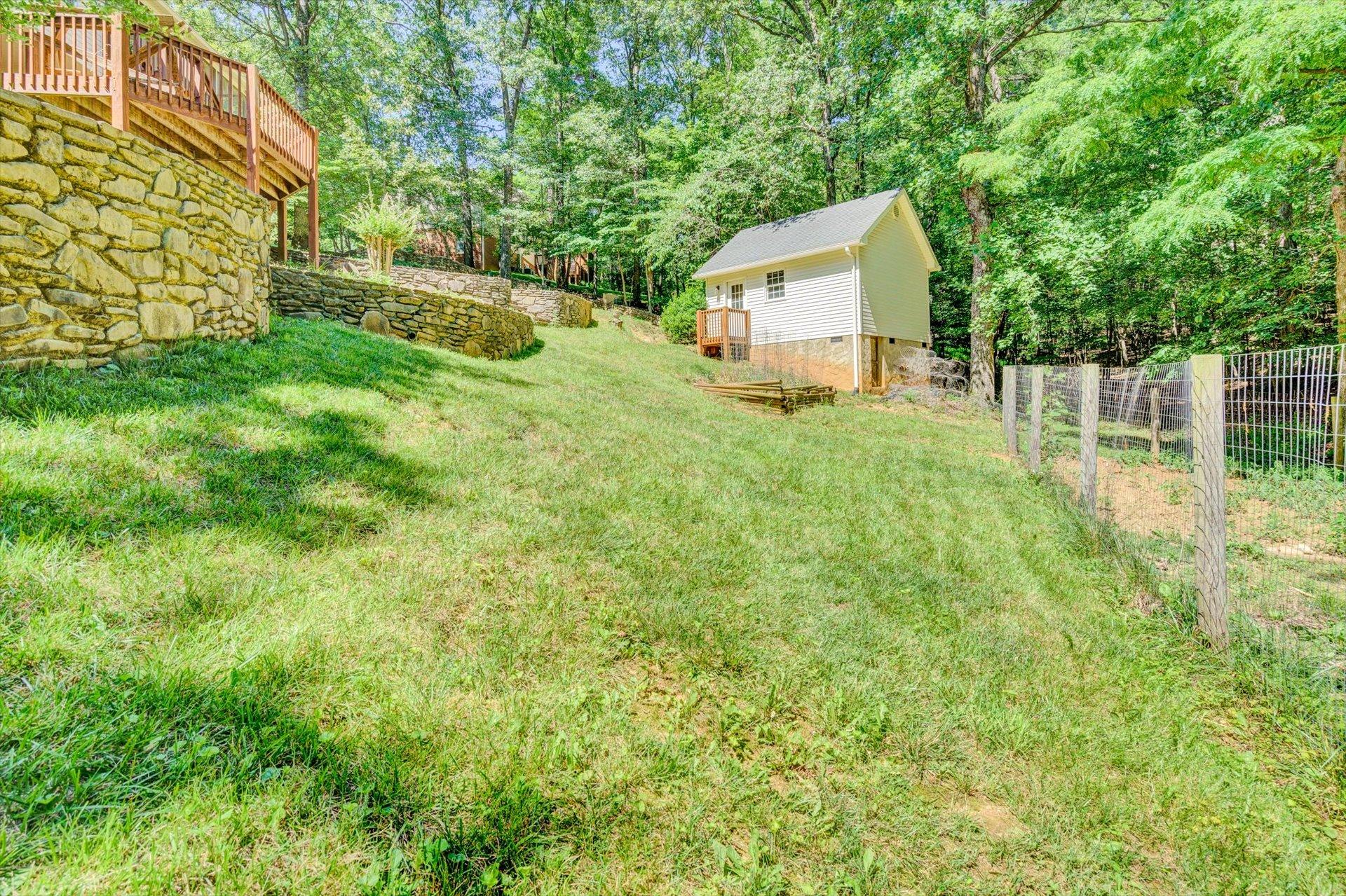 43 Nottingham Lane Blue Ridge, VA 24064 - Photo 46 of 51 a house with green field in front of it