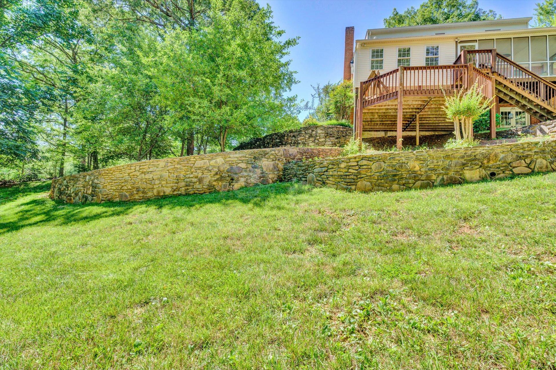 43 Nottingham Lane Blue Ridge, VA 24064 - Photo 47 of 51 a view of a backyard with plants and large trees