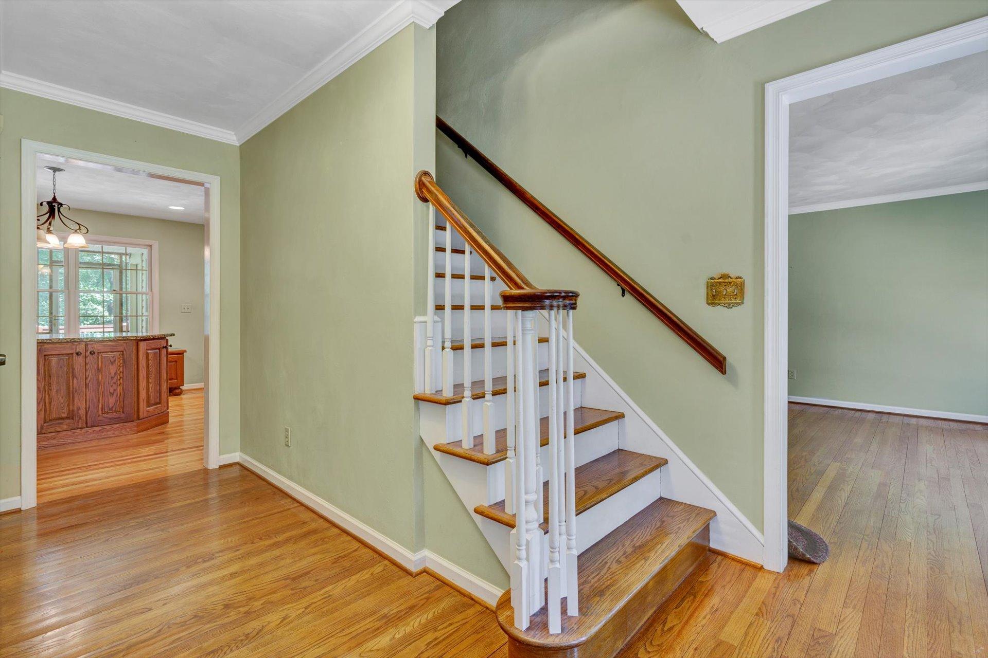43 Nottingham Lane Blue Ridge, VA 24064 - Photo 7 of 51 a view of entryway with wooden floor and stairs