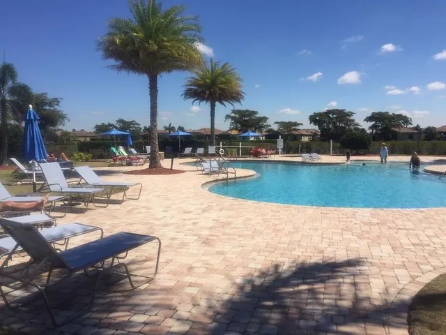 a view of swimming pool with outdoor seating