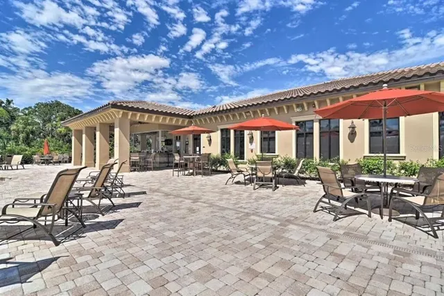 a view of a house with backyard porch and patio