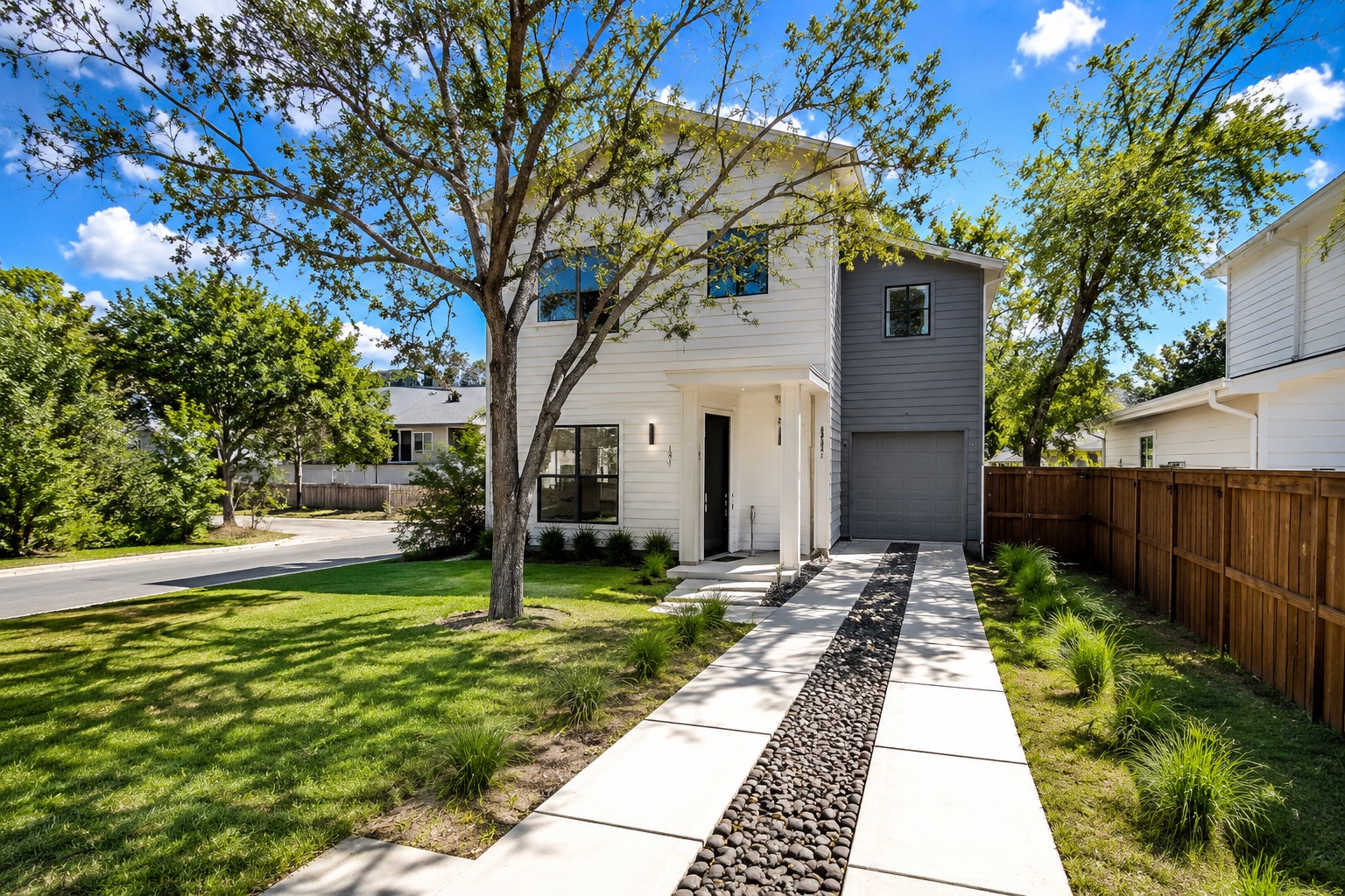 5007 Lott Avenue, Unit 1 Austin, TX 78721 - Photo 21 of 24 Modern facade with a unique rock-lined driveway and inviting entry.