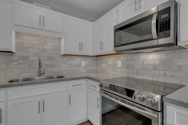 a kitchen with a sink and cabinets
