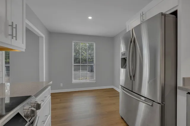 a bathroom with a shower sink vanity and mirror