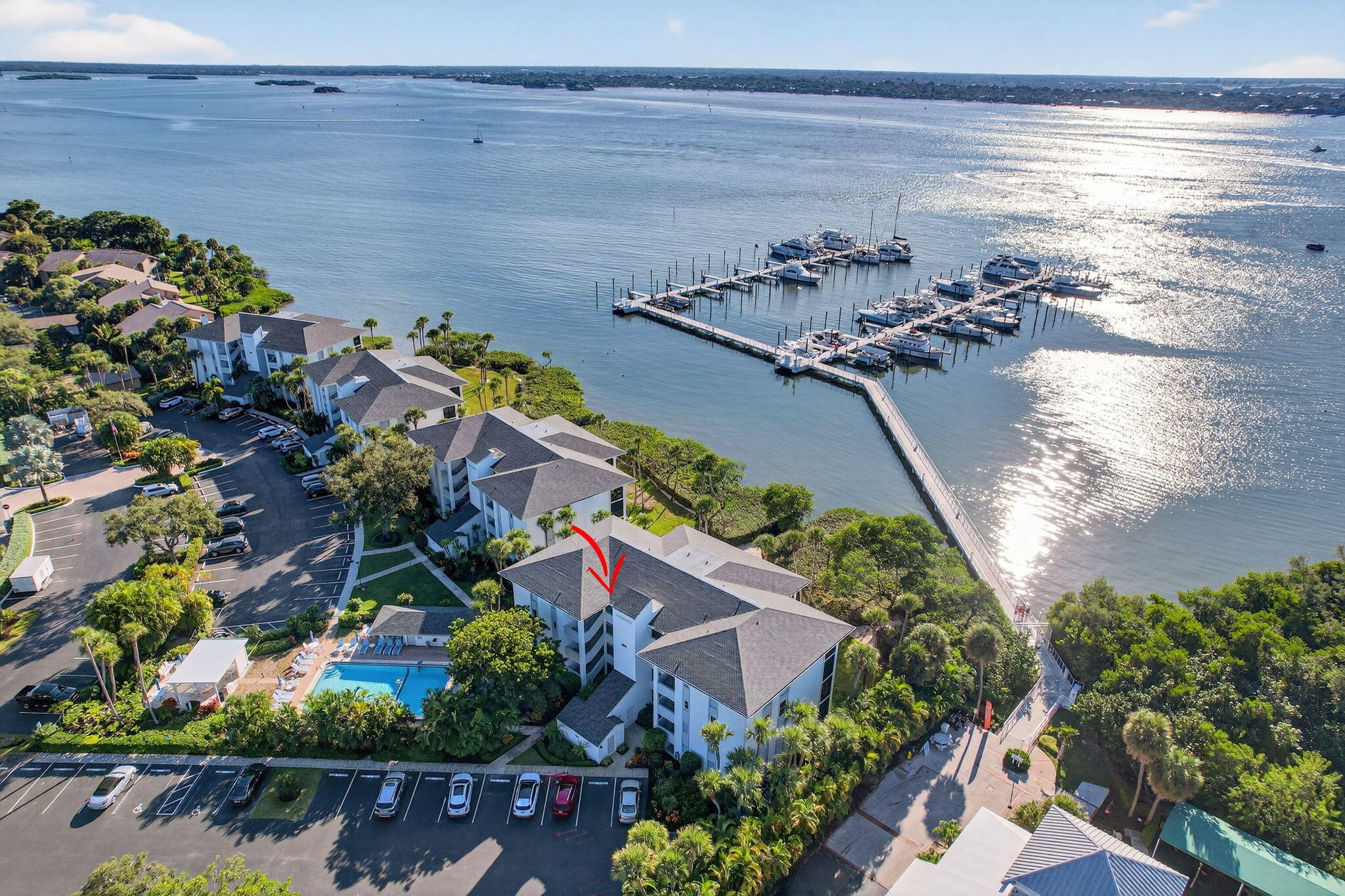 an aerial view of a house with a lake view