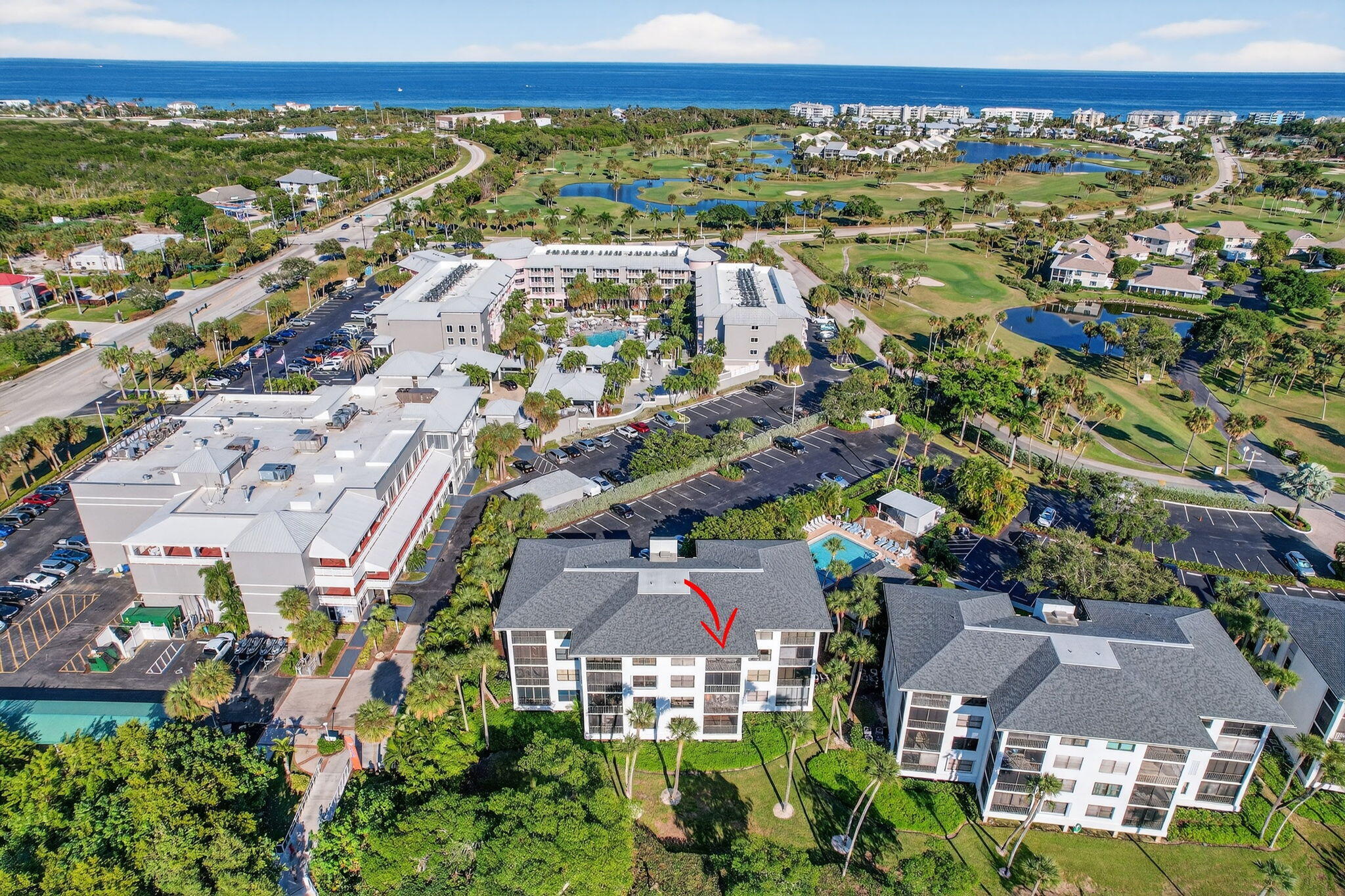 390 Northeast Edgewater Drive, Unit 403 Stuart, FL 34996 - Photo 30 of 46 an aerial view of residential building with outdoor space
