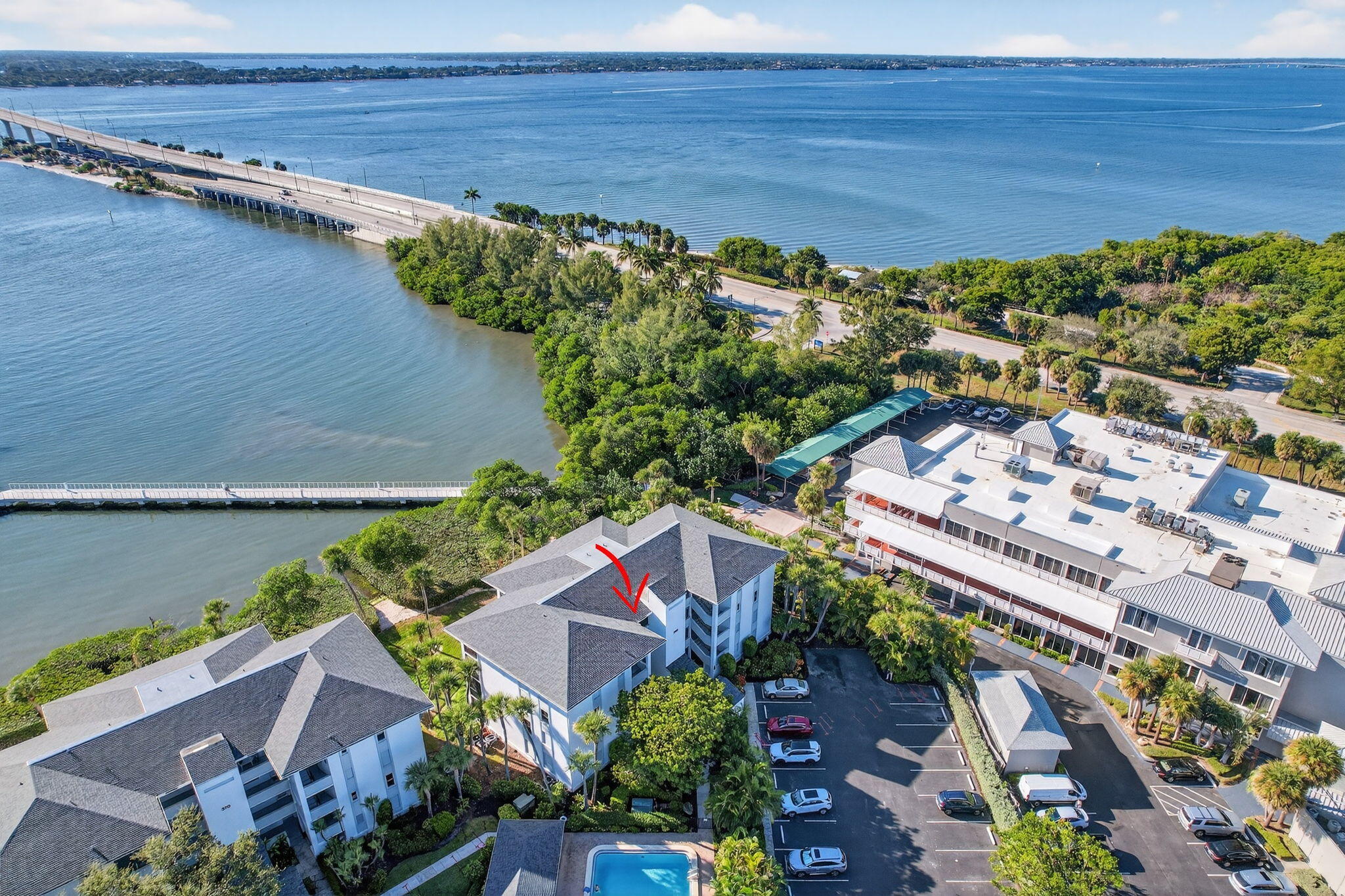 390 Northeast Edgewater Drive, Unit 403 Stuart, FL 34996 - Photo 33 of 46 an aerial view of a house with a garden and lake view