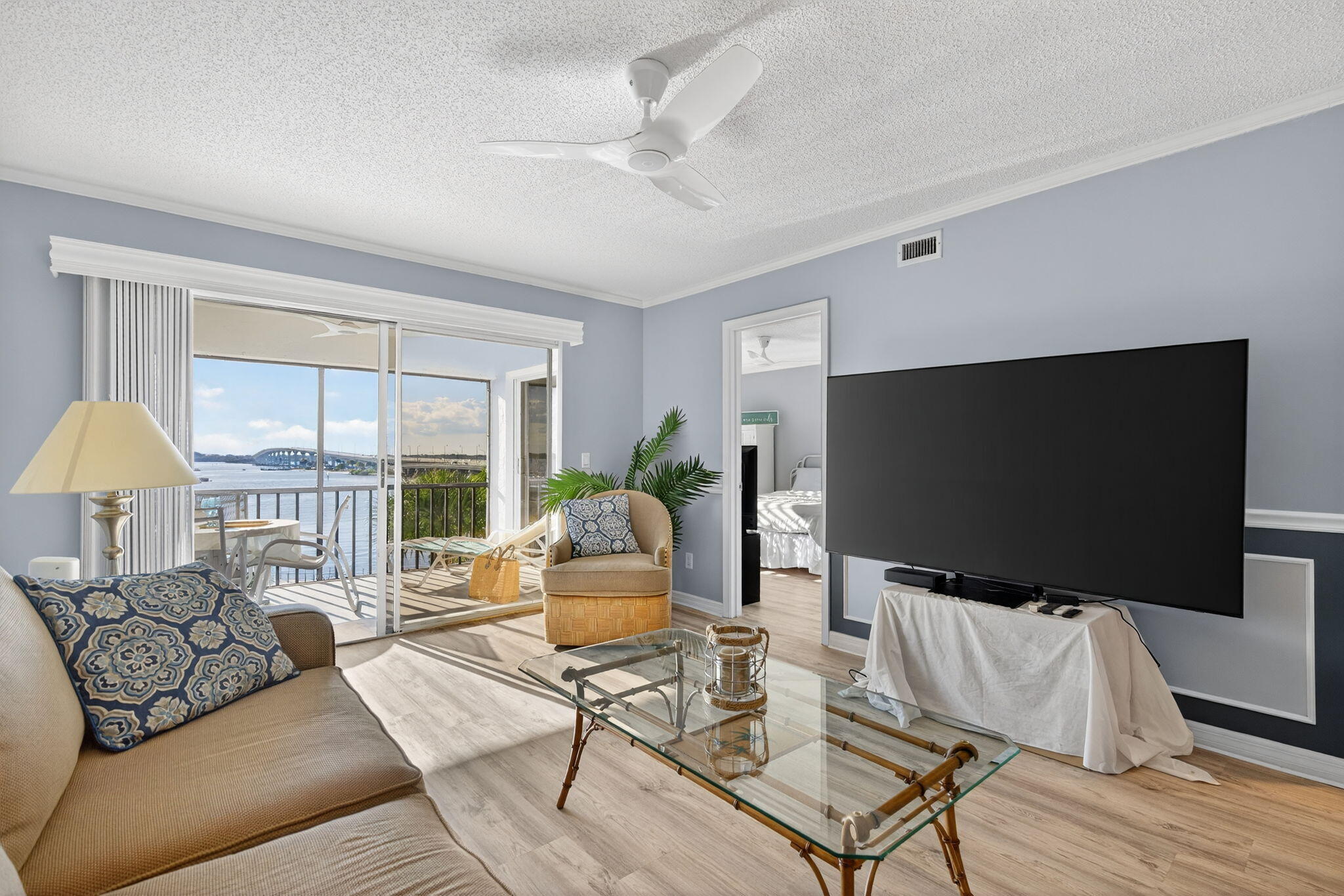 390 Northeast Edgewater Drive, Unit 403 Stuart, FL 34996 - Photo 41 of 46 a living room with furniture and a flat screen tv