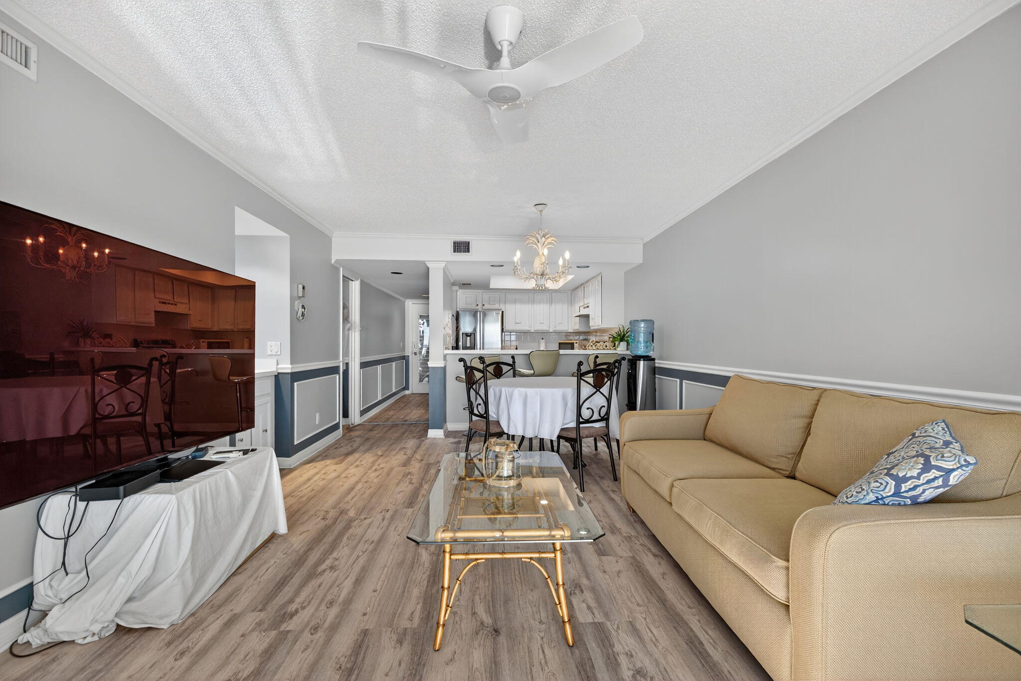 390 Northeast Edgewater Drive, Unit 403 Stuart, FL 34996 - Photo 42 of 46 a living room with furniture and a flat screen tv