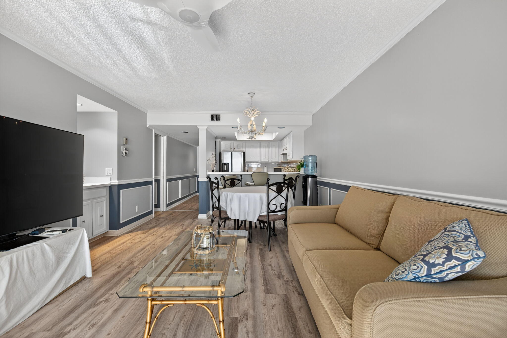 390 Northeast Edgewater Drive, Unit 403 Stuart, FL 34996 - Photo 43 of 46 a living room with furniture and a flat screen tv