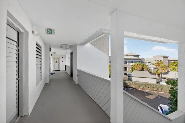 a view of hallway with furniture