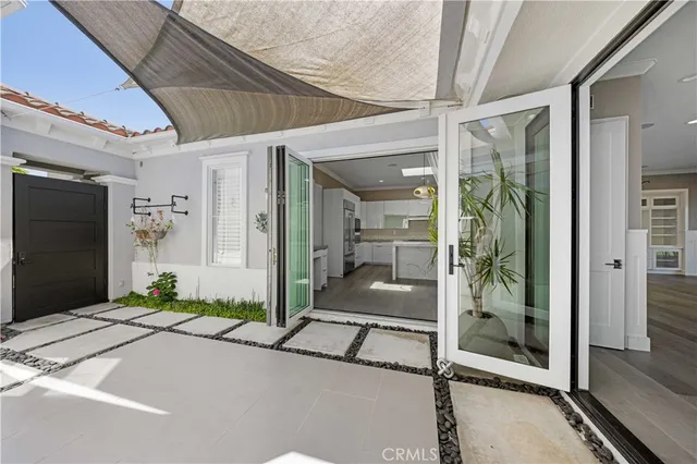 a balcony view with a glass door and shower