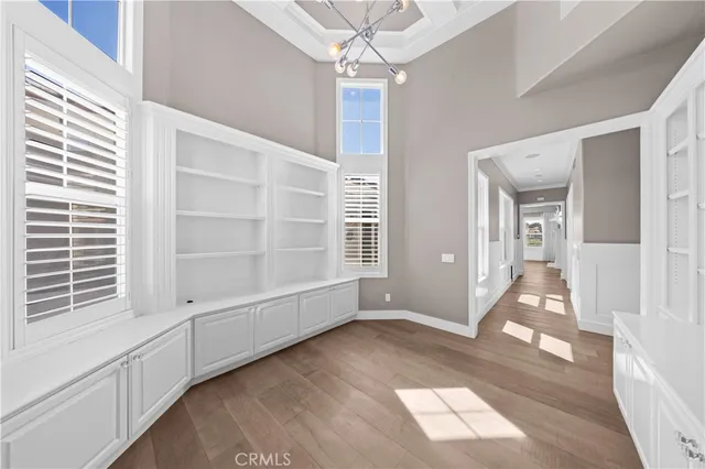 a view of an entryway with wooden floor and door