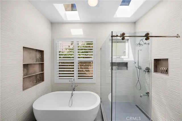 a bathroom with a bathtub and a shower