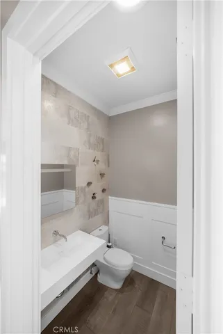 a bathroom with a bathtub sink and toilet
