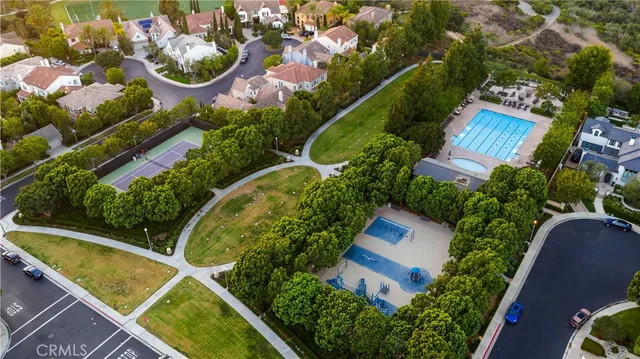 an aerial view of a house with swimming pool and outdoor space