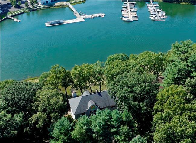 an aerial view of a house with a yard lake residential house and outdoor space